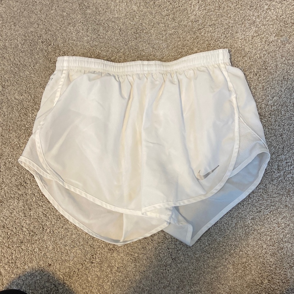 White Nike running shorts